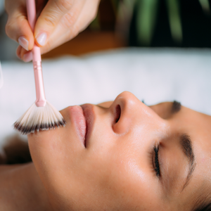 Indian woman getting a chemical peel in a skin clinic